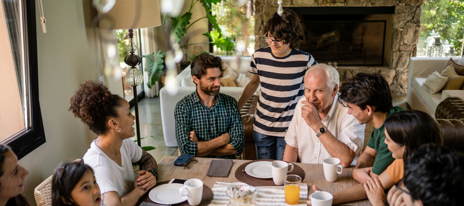 Family sitting around table having a conversation