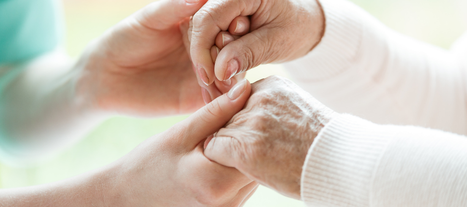 Closeup of Hands - Caregiver Holding Hands of Patient
